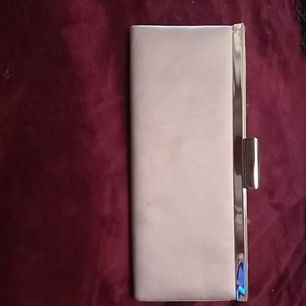 A gold and wight Nordstrom evening clutch